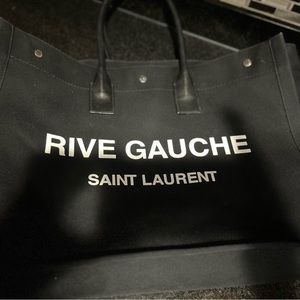 Saint Laurent women tote bag carefully handled